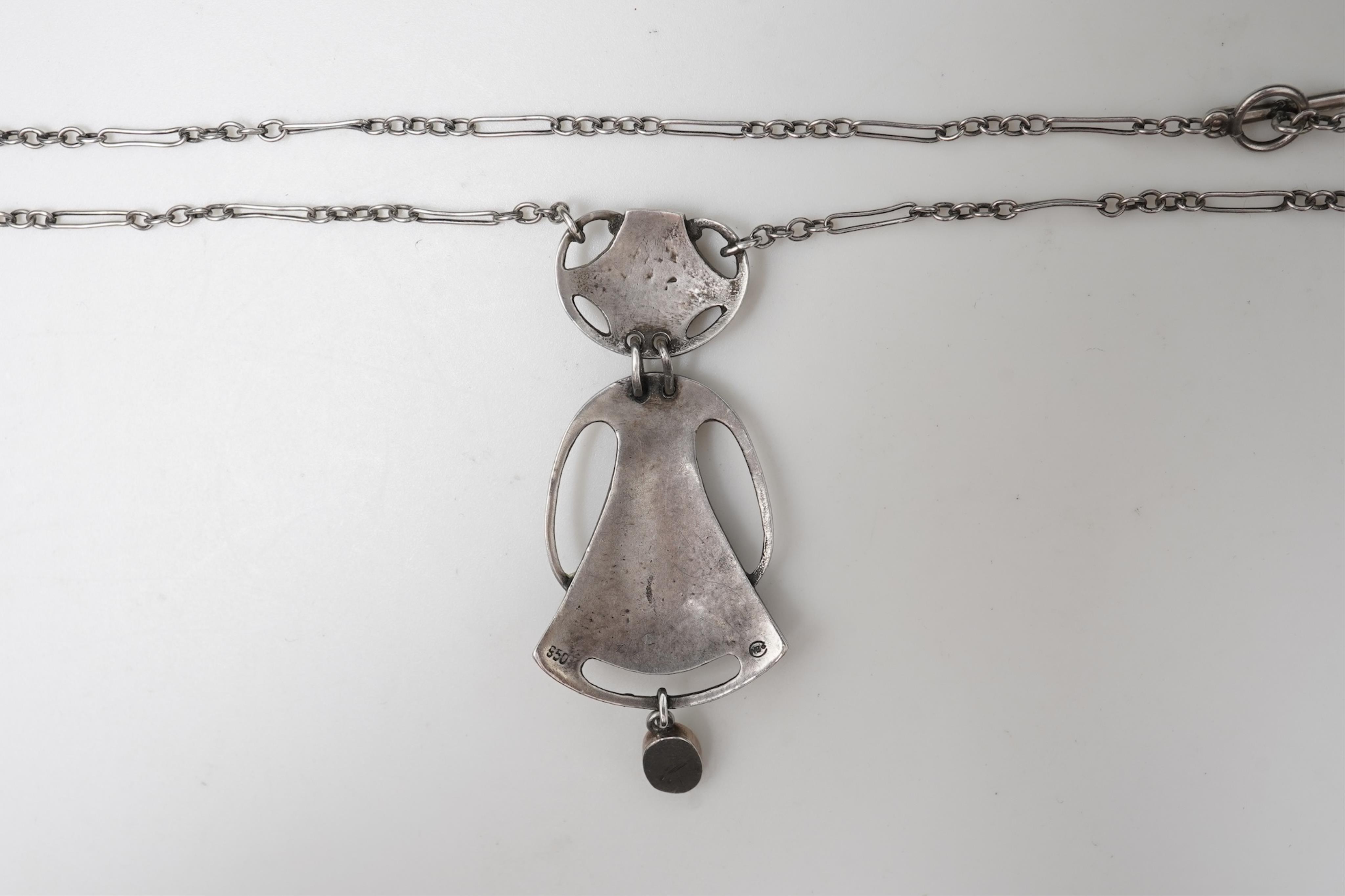 Murrle, Bennett & Co., an Arts & Crafts silver and mother of pearl pendant, circa 1900